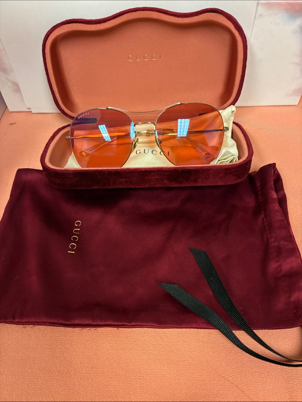 Gucci Women's Round Orange Lens Sunglasses with Gold Frame
